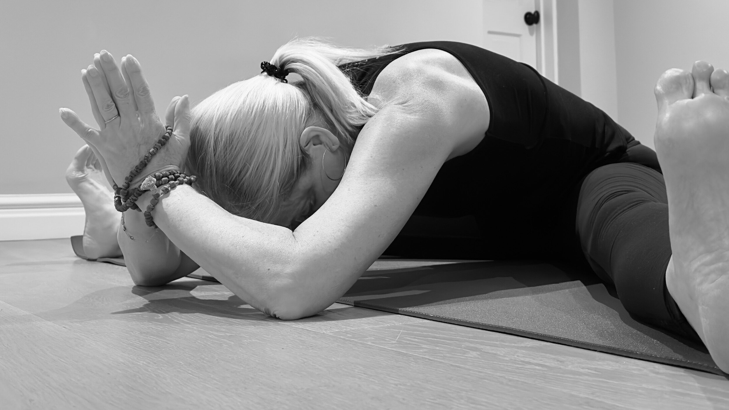 Jilly yoga pose in black and white
